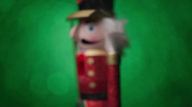 Bright green bokeh background sets the stage as the Toy Nutcracker spins with a little smoke around it, ending with an up-close head shot.