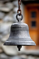 Obraz premium Old metal bell hanging from rusty chain