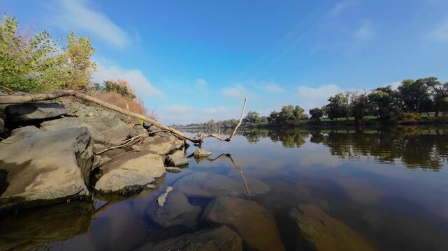 Water View from Rocky Levee Bank on the Sacramento River in Autumn