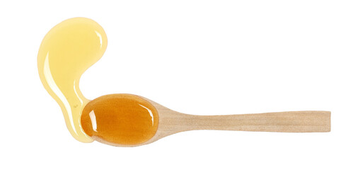Honey in wooden  spoon isolated on white background, top view