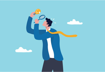 Perfectionist, too much attention to details, high standard goal, focus on perfect result concept, perfectionist businessman with magnifying glass looking at every details of lightbulb idea.