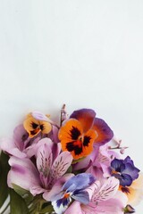 Orange violets and lilac alstroemeria are a festive bouquet.