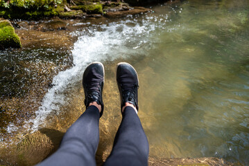 Woman legs with barefoot hiking shoes in the  mountain 