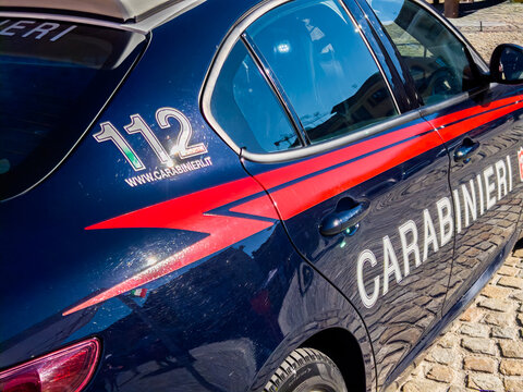 Italy - November 4, 2025: Side of an Italian Carabinieri car with the 112 emergency number logo and the word &ldquo;Carabinieri&rdquo; written on it.