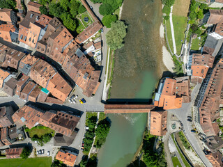 Aerial view of Sarine river flowing through the old town of Fribourg in Switzerland, Europe. Tranquil river on a summer day.