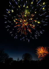 Vibrant Fireworks Exploding in Night Sky during Christmas Lights Switch-On Event, Burton upon Trent, UK