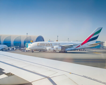 11 23 2025 - Dubai, UAE. Emirates airlines Airbus A380-800, the largest passenger aircraft in the world taxiing at Dubai International Airport