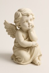 Fototapeta premium Dreamy porcelain angel figurine kneeling with wings, soft beige statue on neutral background