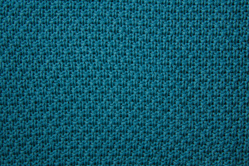 Textured blue fabric showcasing a beautiful woven pattern with intricate details