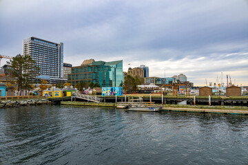 A scenic view of Halifax's bustling waterfront with modern architecture and a serene harbor.