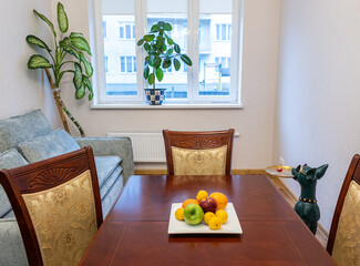 Interior photo of Living room with furniture, table and decorative elements.