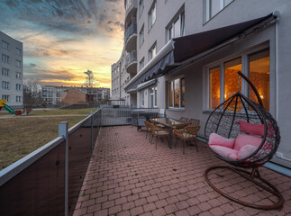 A terrace of an apartment in a multi-apartment building with a recreation area.