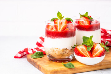 Strawberry cheesecake in glass, healthy dessert.