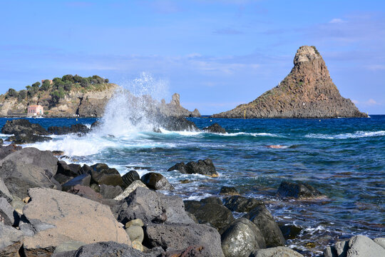 Cyclopean Isles - Faraglione Grande -rock formation on the sea