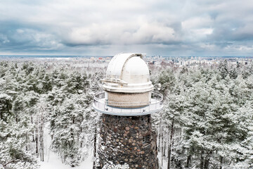 Old observatory tower in the Glen park. Tallinn, Estonia, against dramatic sky