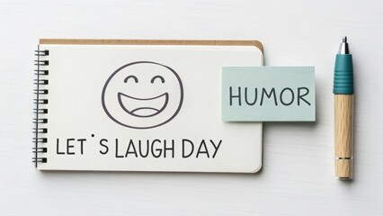 A happy emoji celebrating Let's Laugh Day on a white card