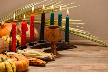 Kwanzaa Celebration Setup. A festive Kwanzaa display with candles, fruits, and decorative elements