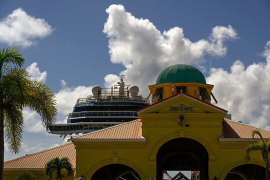 BASSETERRE, ST KITTS - NOVEMBER 05, 2005:  Sign for Port Zante with cruise ship in background
