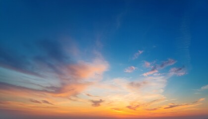 Obraz premium Soft Gradient Sunrise Sky Background With Gentle Clouds And Warm Orange Blue Tones Perfect For Posters Social Media Web Design Or Inspirational Artwork Calm And Uplifting Atmosphere