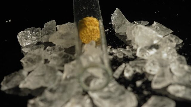 Crystal meth drug in rocks with smoking crack pipe on the table of addict. Addiction and drugs trafficking. Illicit drugs very potent and addictive, substances altered for street sale by drug dealer.