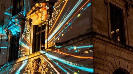 Closeup medium view of a building exterior with programmable projection lighting casting intricate designs and animations creating a captivating visual display.