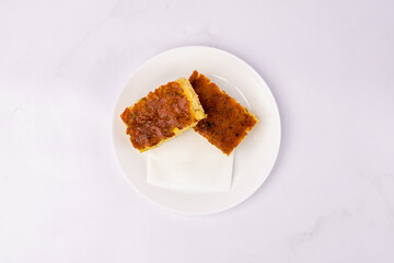 Golden Homemade Pastry Slices on White Plate.  Minimal Food Photography
