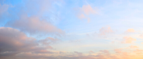 heaven sky is blue with a few clouds scattered throughout. The clouds are white and fluffy, giving the sky a peaceful and serene