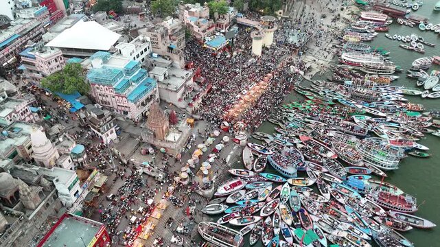 Drone Shot of Devotees Watching Ganga Aarti Fire Ritual on Varanasi Riverfront Crowded 4k Landscape