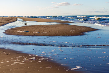 Coastal Scenery: Golden Light on the Baltic Beach Water Pools
