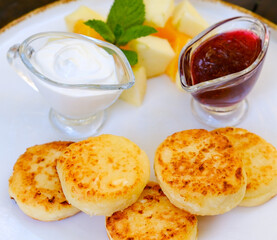 Top view of cottage cheese pancakes with jam. Breakfast concept. Top view, text space. High quality photo