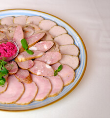 Traditional meat platter with pickles, herbs and beetroot dip on plate. Perfect for gourmet dining. High quality photo