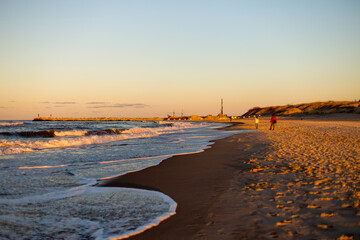 Expansive Coastal Landscape: Sunset View of the Beach and Sea
