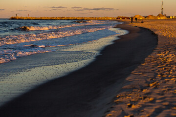 Expansive Coastal Landscape: Sunset View of the Beach and Sea