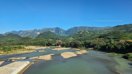 Rural Mountain River Valley View Low Water in laos landscape. Vibrant natural laos landscape...