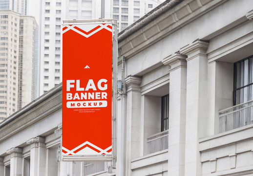 Tall Vertical Flag Banner Mockup Attached to an Urban Building Facade