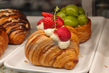 Strawberry croissant in a coffee shop
