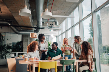 Diverse startup team collaborating during an informal office meeting