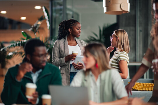 Diverse business professionals collaborating in a modern office - Powered by Adobe