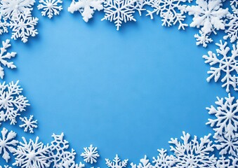 A blue background with white snowflakes forming an intricate border around the edges, creating a festive and snowy atmosphere for Christmas 