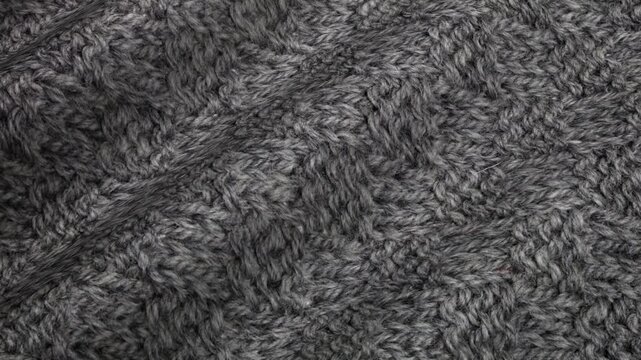 Diamond knit texture waves forming in soft heather gray motion inside an exclusive balanced abstract background design