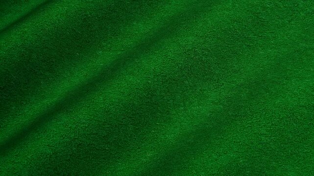 Dense felt texture waves moving in deep emerald green flow illuminated by an elegant richly toned abstract background