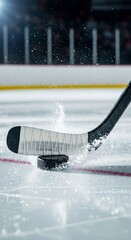 Dynamic close-up of an ice hockey stick hitting a puck on a bright rink, creating a spray of ice. Captures intense game action and winter sports.