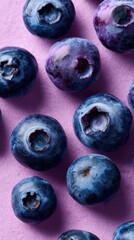 Fresh Blueberries on Purple Background