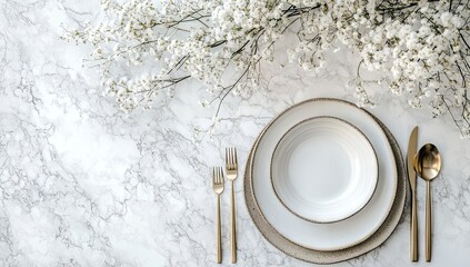 Photo of a minimalist dining table setting with elegant plates and cutlery on a white marble surface, adorned with delicate flowers for an upscale aesthetic