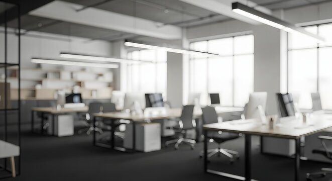 Modern openplan office interior with contemporary furniture and bright natural light streaming through large windows