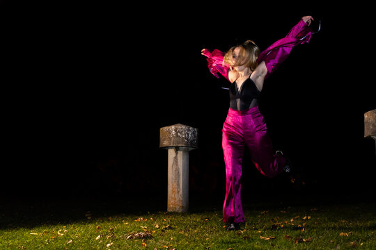 Moonlit dancer in vibrant pink costume