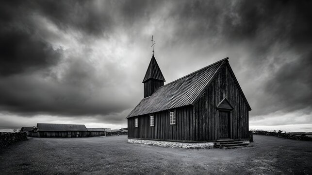 Dark wooden religious structure stands beneath a dramatic, brooding cloudscape