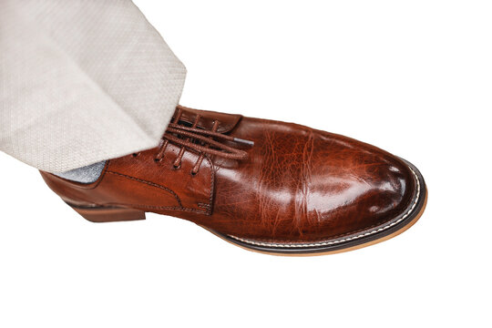 Men's brown-red shoes made genuine glossy leather white isolated background