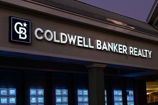 Coldwell Banker Realty exterior real estate listing lit up at night in Lakewood Ranch, Florida