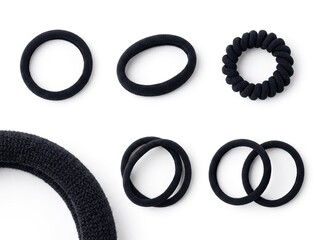 Collection of black hair ties and elastic bands on white background